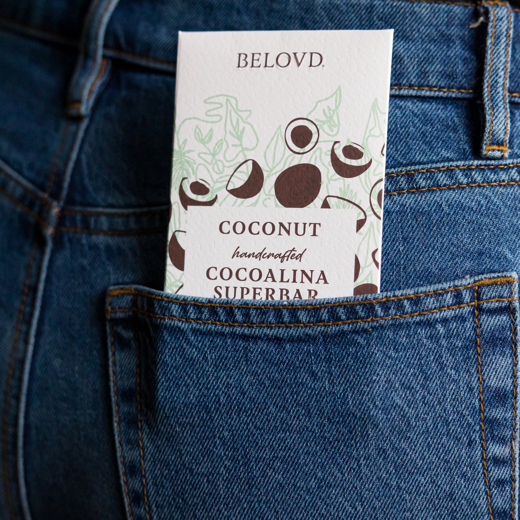coconut cocoalina chocolate bar in a jean's back pocket