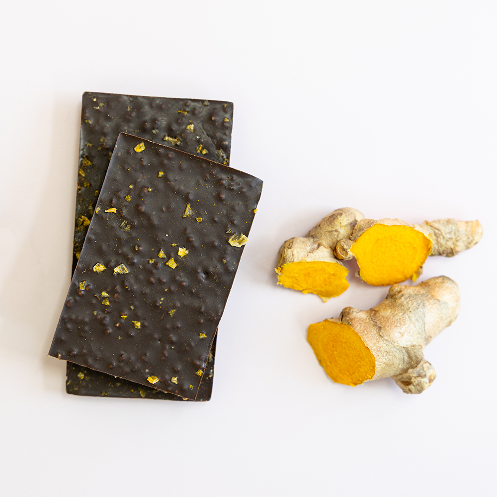Belovd Chocolate bars next to raw ginger