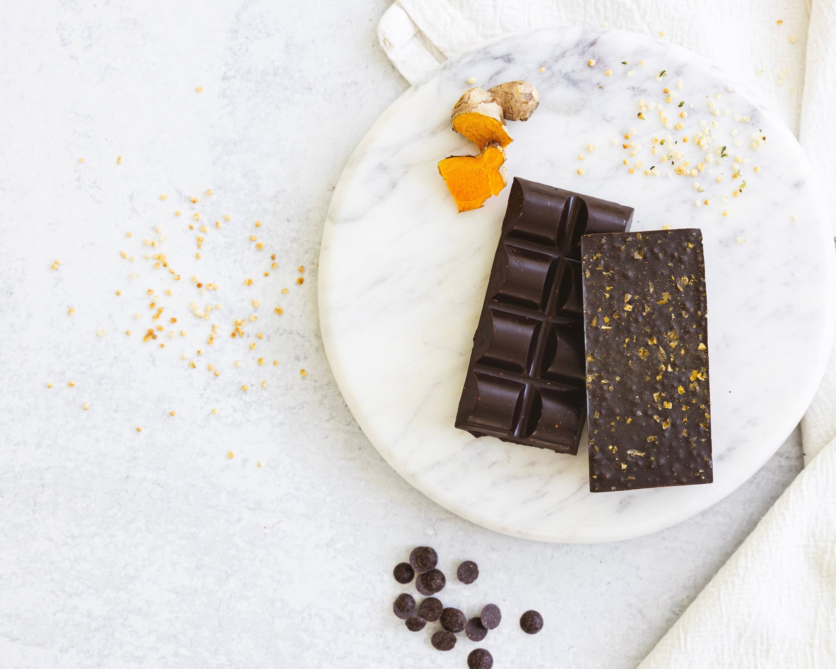 Belovd Chai Spice chocolate bars next to ginger on a plate