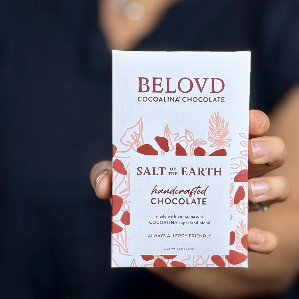 Hand holding Belovd Salt of the Earth Chocolate Bar 